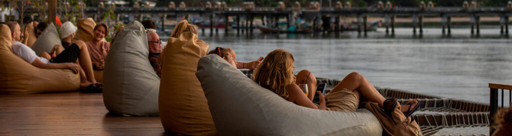 Women-sitting-on-bean-bags-at-a-restaurant-looking-at-the-view
