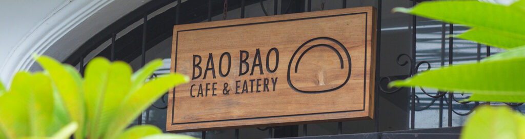 Wooden-sign-of-Bao-Bao-cafe-with-greenery