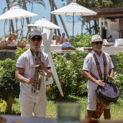 man playing sax and another man playing drums